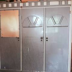 hy there is  wardrobe which is made up of cheap board,with 3 doors .