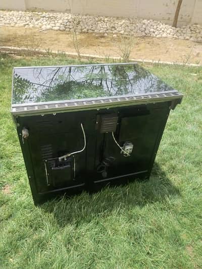 ambassador coking range glass top 5 burnrs, oven with separate potions