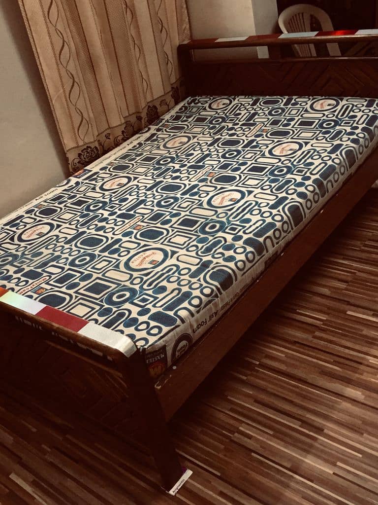 WOODEN BED  size 4ft by 6 ft with master molty foam 0