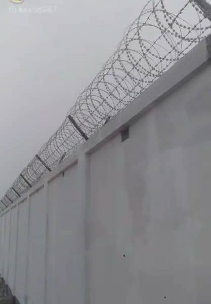 Chain link fence. . Razor  wire. . barbed wire. 13