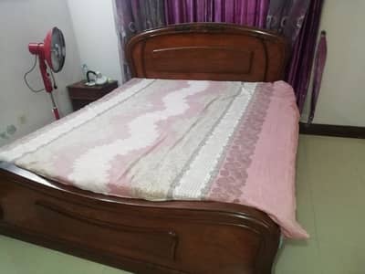 solid wooden bed with dressing table
