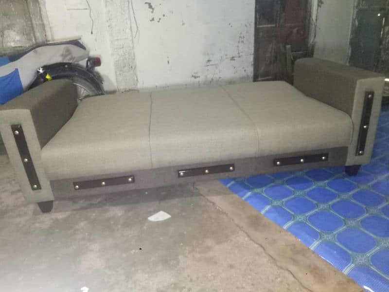 SOFA CUM BED WITH ARM REST 14