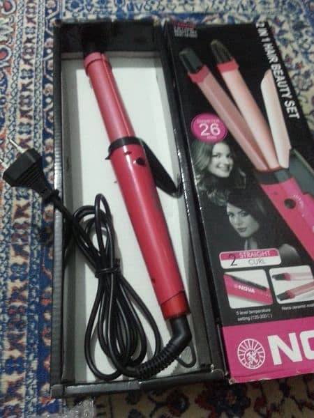 Nova straightener & curler. . . . 0