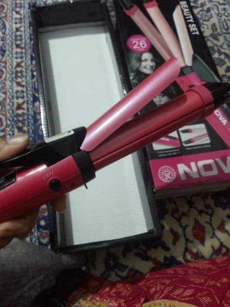 Nova straightener & curler. . . . 2