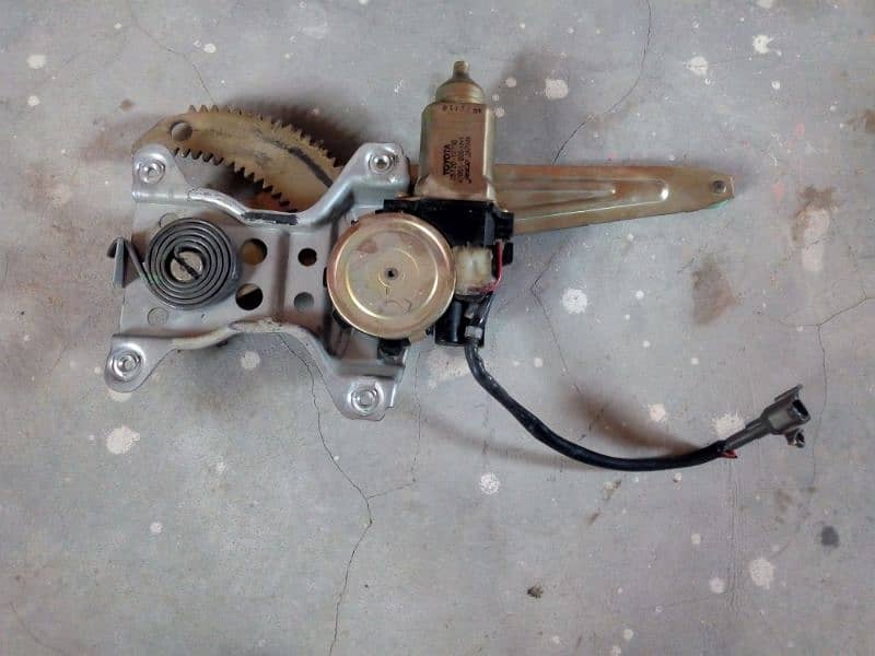 Toyota Indus Corolla genuine left side power window machine and motor 1