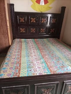 king size double bed wooden with two side tables