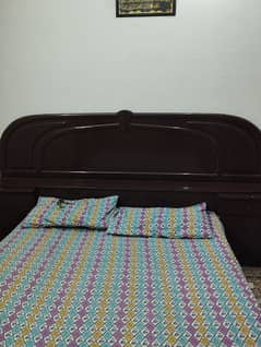 beautiful bed with two draw