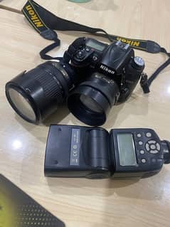 Nikon D7000 with 35mm, 18-140 lenses and flash gun