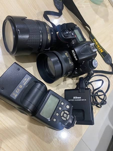 Nikon D7000 with 35mm, 18-140 lenses and flash gun 2