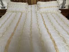 white and golden bedsheet