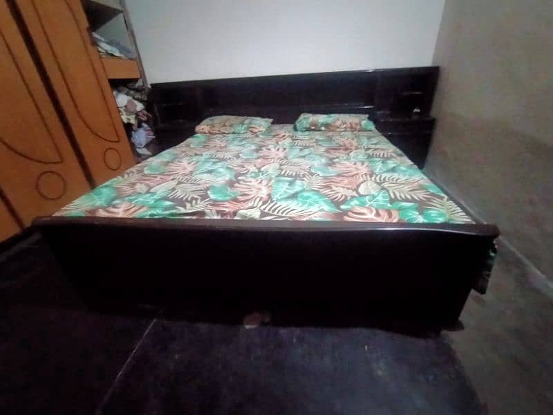 A bed with two side table, 1