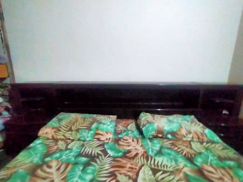 A bed with two side table, 2