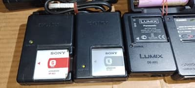All types of camera battery chargers. 0
