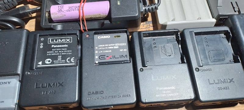 All types of camera battery chargers. 1