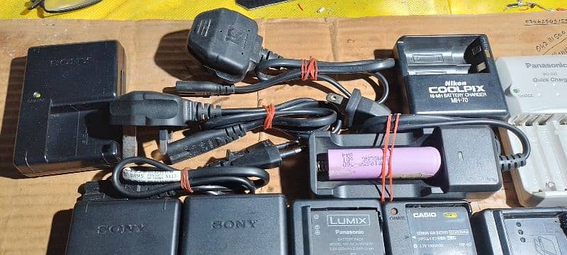 All types of camera battery chargers. 2
