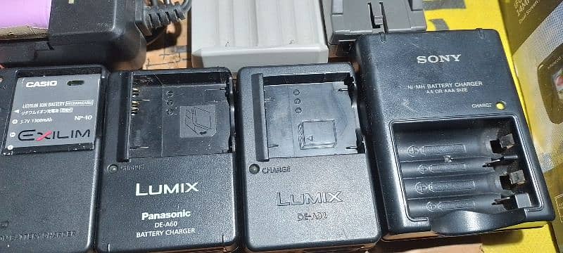 All types of camera battery chargers. 4