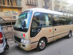 Coaster Saloon and Hiace Grand Cabin for Rent in Lahore 0
