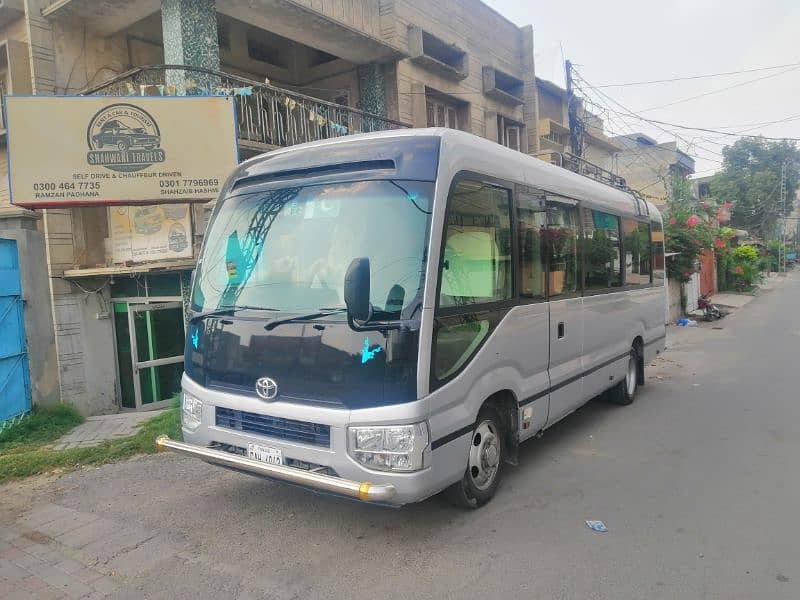 Coaster Saloon and Hiace Grand Cabin for Rent in Lahore 4