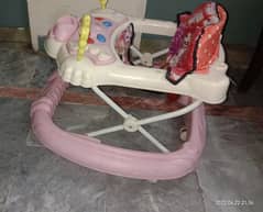 Pink baby walker used but in good condition