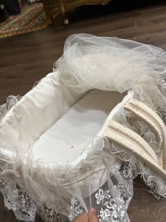 gold and white lace baby bassinet