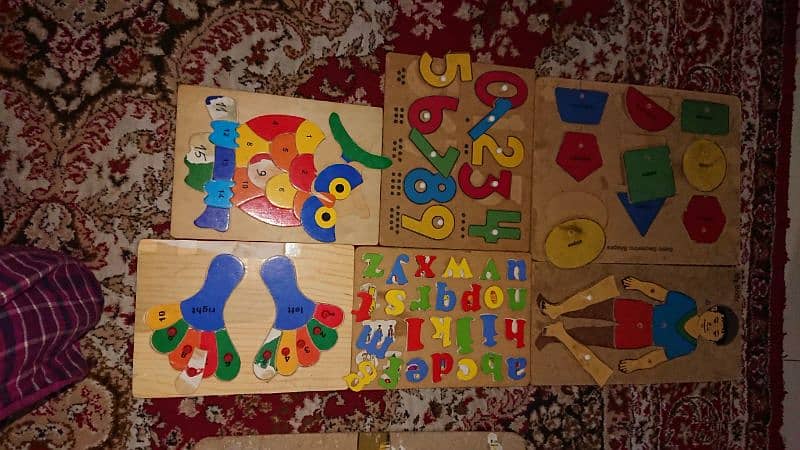 Kids learning wooden puzzles 4