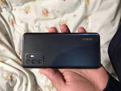 Oppo Reno 6 with charger