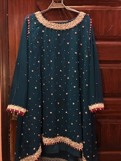 peacock color dress with white pearls