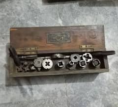 Vintage taps and die set used go create screw threads. Made in England