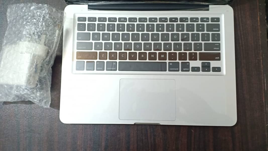 APPLE MACBOOK PRO WITH LIGHT KEYBOARD AND LOGO 2