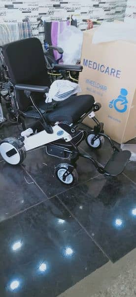 wheelchair electric motorized remote controlled foldable umrah hajj 1