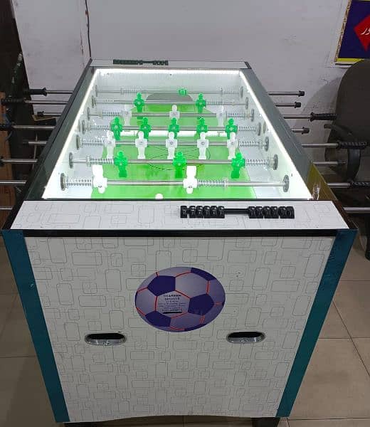 Arcade video game foosball football token game 8