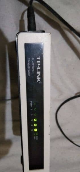 TP-Link 5 port switch device with adapter. 2