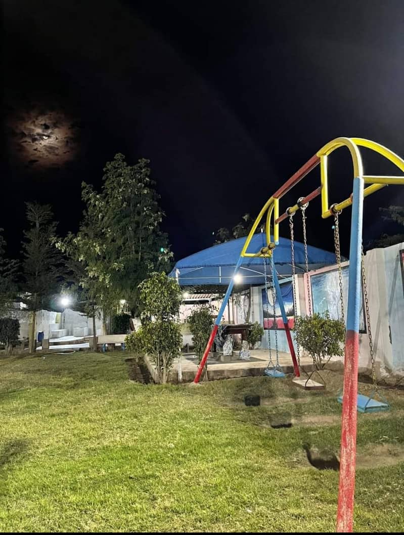 Play ground swings and roof parking shade. 1