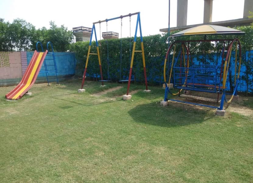 Play ground swings and roof parking shade. 2