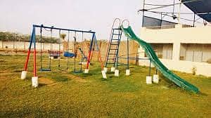 Play ground swings and roof parking shade. 3