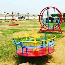 Play ground swings and roof parking shade. 5