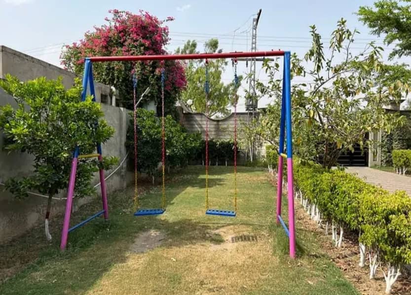 Play ground swings and roof parking shade. 9