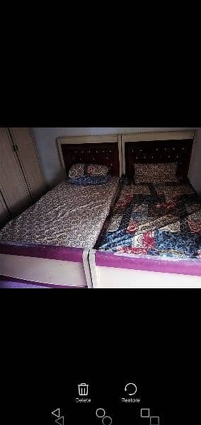 single beds and side table pink and creame colour