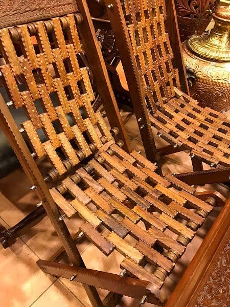 pair of 2 wooden relaxing chairs with 1 table 1