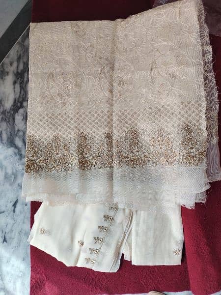 Off white khaadi net embroided dress. 3