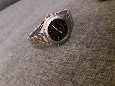 fossil watch and Swanson watch