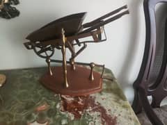Antique brass wheel barrow show piece.