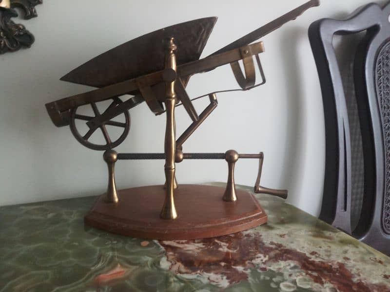Antique brass wheel barrow show piece. 7