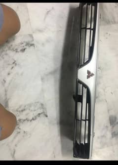 Mitsubishi original grill of 1996 content at this number 0300 8258028