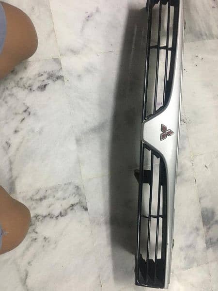 Mitsubishi original grill of 1996 content at this number 0300 8258028 8
