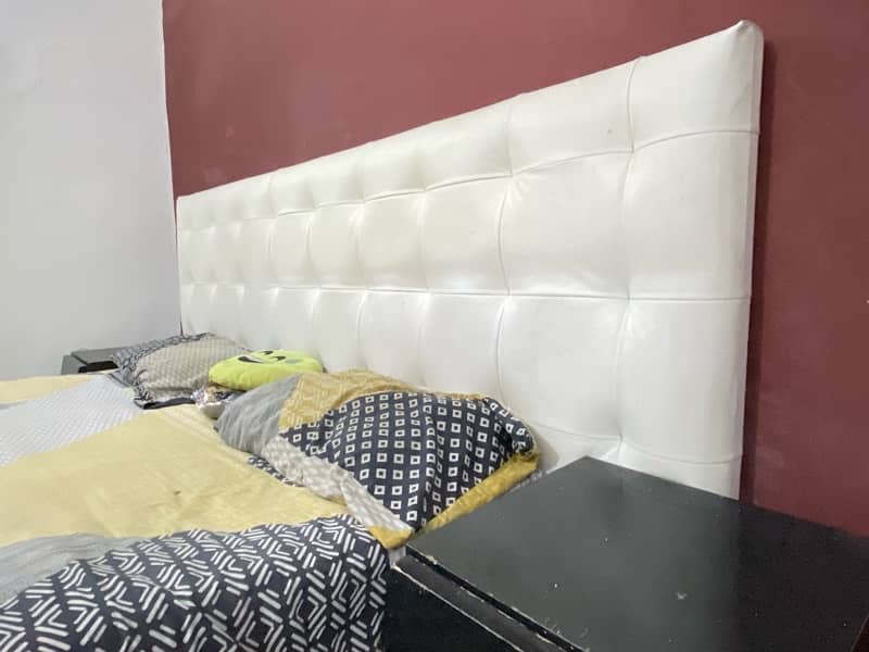 king size bed in good condition white and black theme . 1