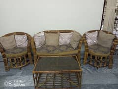 Cane sofa set with table and cushions