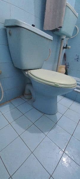 Sky blue commode and wash basin 5
