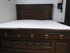 King size wooden bed with spring mattress and side tables