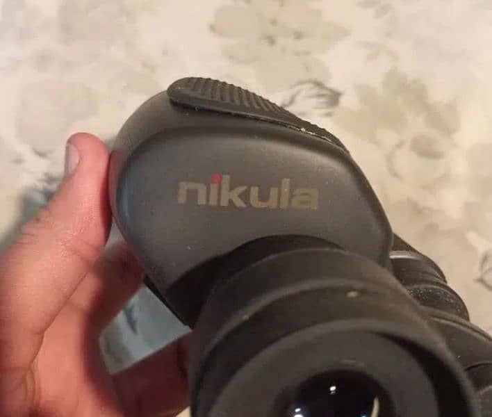 Nikula binocular 7-15x35mm. Made in Arizona, usa. 9